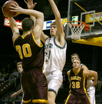  Holy Family's Matt Quammen defends Bagley's Luke Knutson during Thursday's quarterfinal.